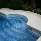 Natural stone Levante Crema antique Pool edge, glass mosaic in the pool