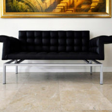 Natural stone floor Levante Crema limestone with futuristic leather sofa