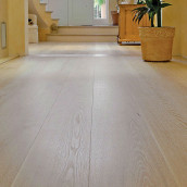 Brushed castle floorboards in front of staircase