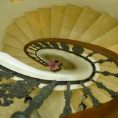 Stone staircase from above in Levante Crema limestone spiral staircase