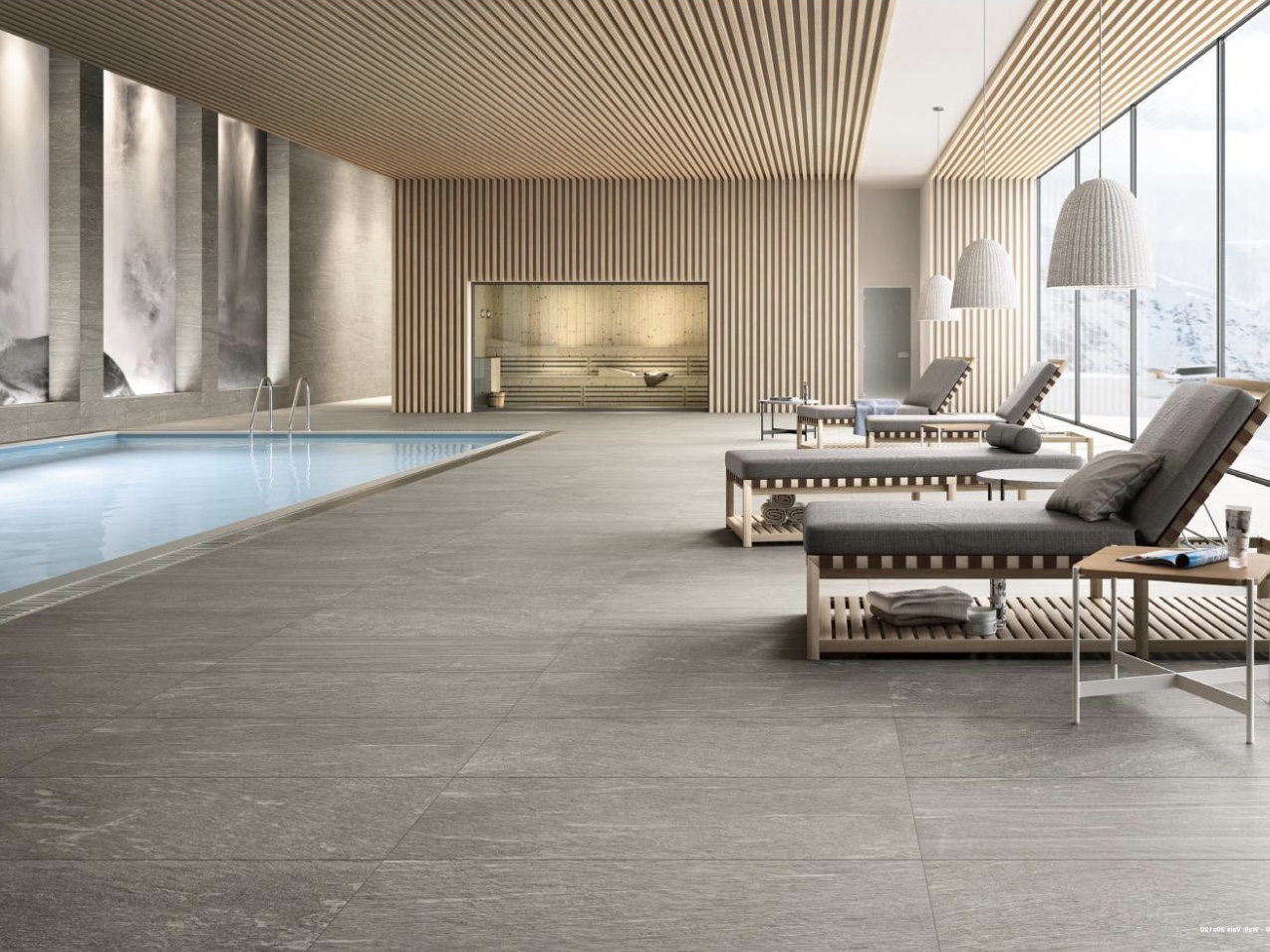 Pool area with stone slabs in grey porcelain stoneware from SCHUBERT STONE
