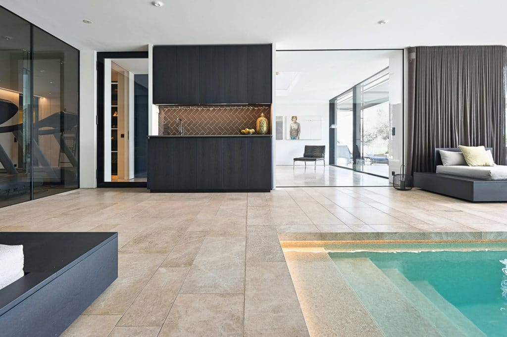 Wellness area with natural stone floor and pool